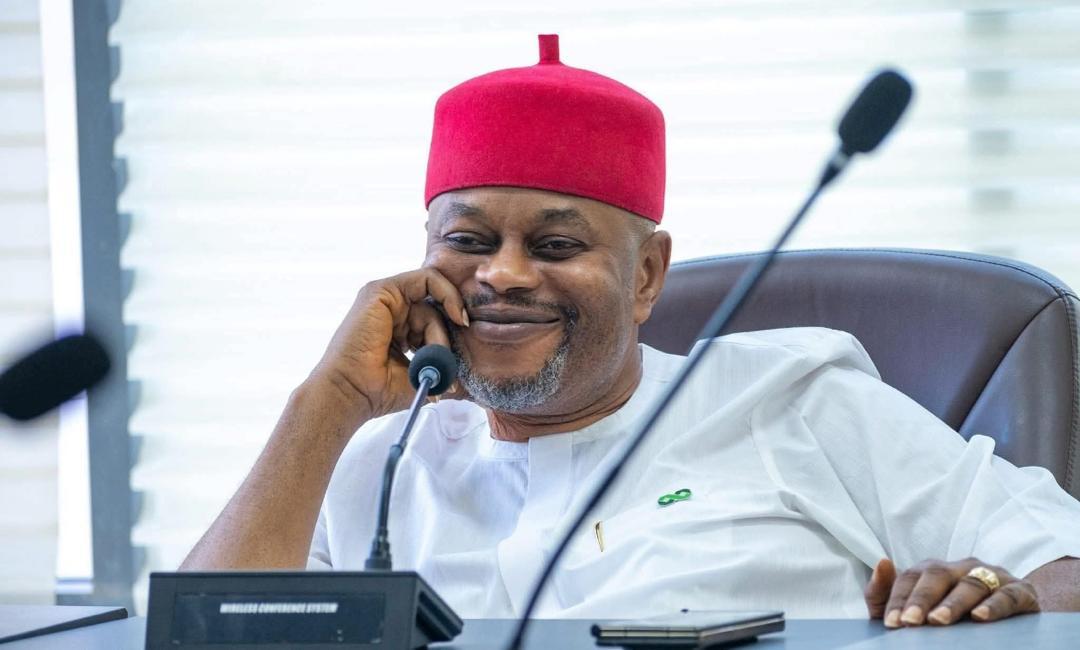 Campaign portrait of Chief Uche Nnaji wearing a red cap